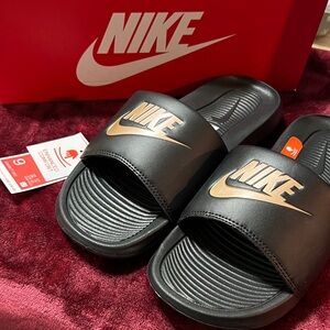 Nike Black Slides with Gold Accents
